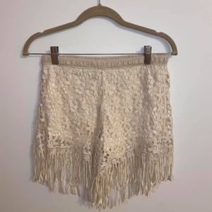 Ivory lace shorts with fringe hem